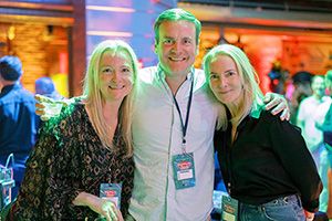 Friends smile for the camera together at the Bash