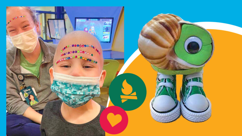 A child and adult wearing masks and forehead gems smile indoors. Beside them is a handmade green snail with sneakers, on a colorful background with heart and campfire icons.