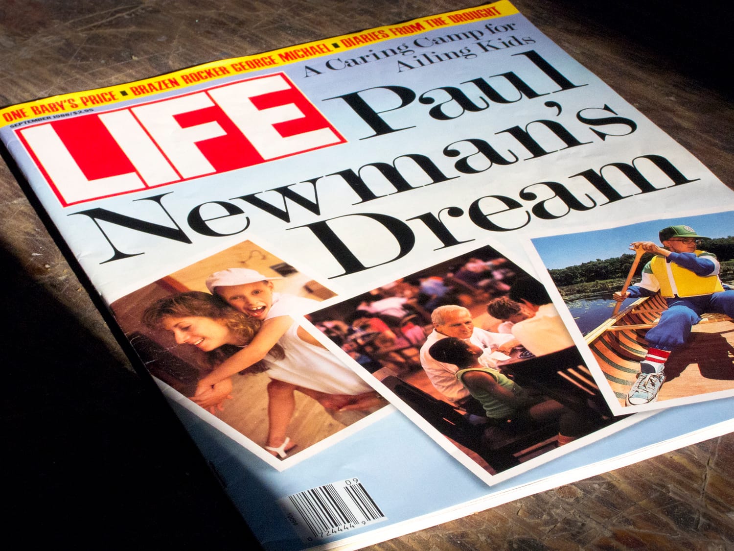 LIFE magazine cover featuring the headline Paul Newmans Dream with photos of children playing and eating. The issue focuses on a camp for ailing kids and highlights Paul Newmans involvement.