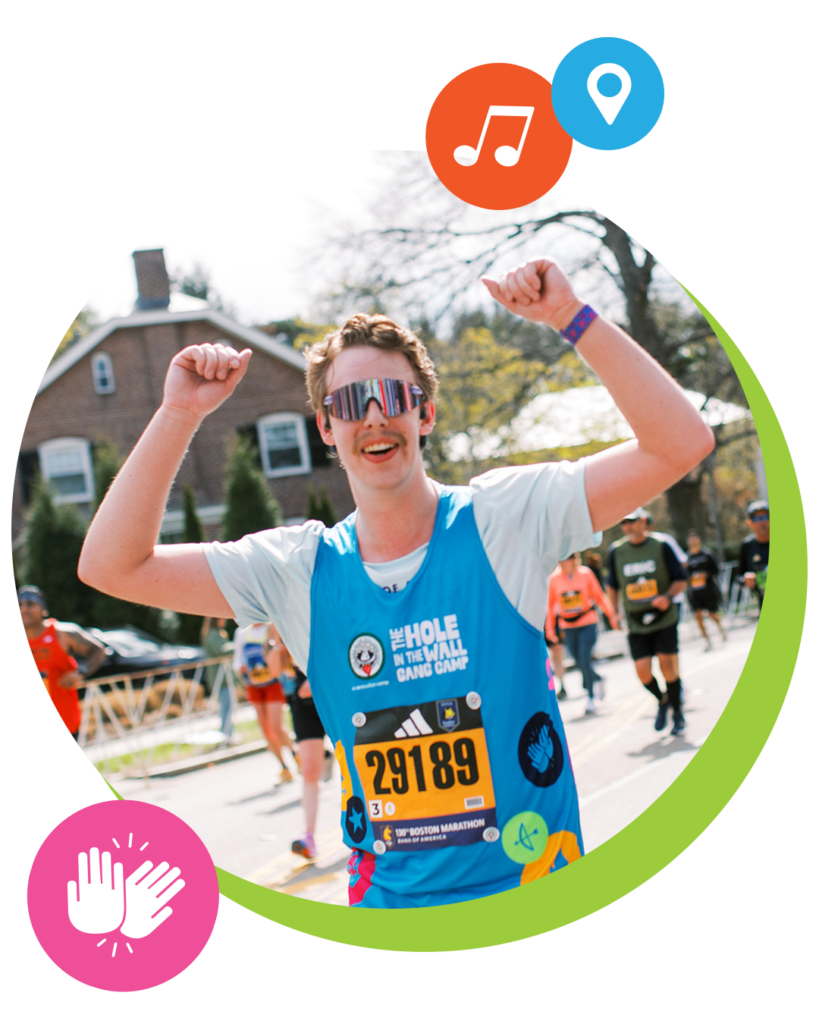 Runner with race bib 29189 raises both arms in celebration while crossing a finish line, wearing sunglasses and a blue shirt. Other runners and a house appear in the background. Colorful icons decorate the image.